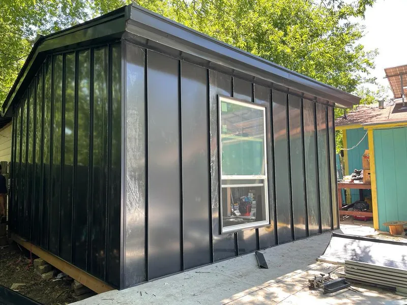 Black standing seam metal wall panels for Roof Inspection in Tampa