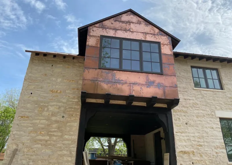 Copper metal panel facade on a stone building for Metal Roof Coating in Tampa